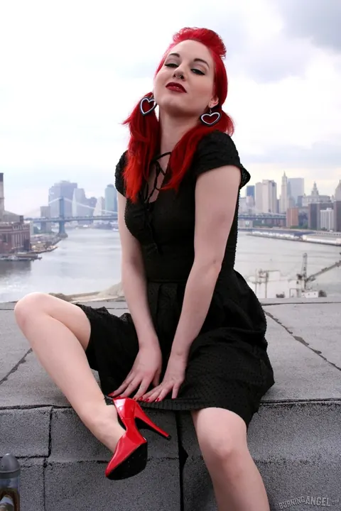 Angela Ryan: Busty Redhead Poses in Stockings and Heels on the Rooftop Balcony – photo 1 of 17
