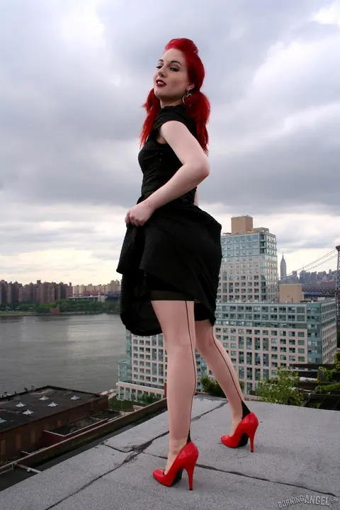 Angela Ryan: Busty Redhead Poses in Stockings and Heels on the Rooftop Balcony – photo 4 of 17