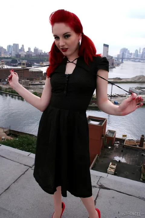 Angela Ryan: Busty Redhead Poses in Stockings and Heels on the Rooftop Balcony – photo 5 of 17