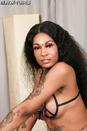 Tattooed Ebony Trans Woman Strips Nude and Flaunts Her Big Ass