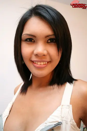 Asian Trans Woman Peels Off Her Top and Reveals Her Bare Chest