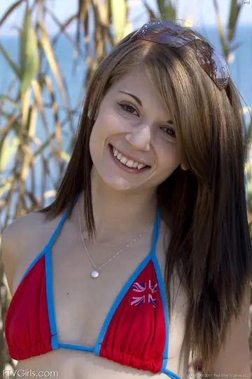 Sensi Pearl – Slim Brunette Shows Her Body in Panties on the Beach