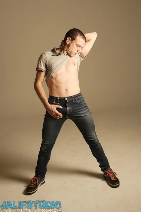 Man Strips Nude on a Chair and Poses – photo 1 of 21