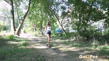 European Brunette with Small Natural Tits Spreads Her Shaved Pussy Outdoors