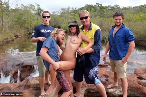 Brunette MILF in Glasses Has Group Sex Outdoors with Beer – photo 9 of 16