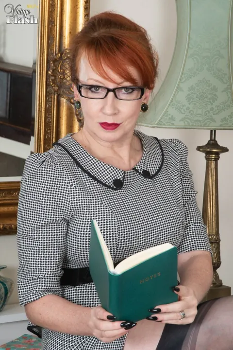 Mature European Redhead Fingers Her Pussy on an Office Desk – photo 4 of 16