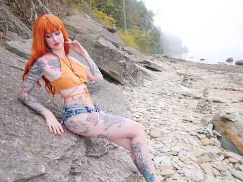 Skinny Redhead in Stockings and Glasses Poses Outdoors – photo 11 of 14