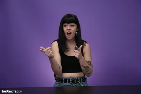 Lily Lane: Brunette with Enhanced Tits and Tattoo Reacts While Clothed – photo 21 of 21