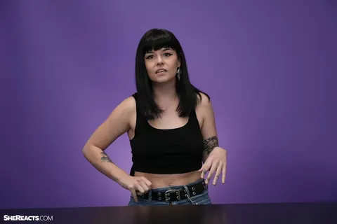 Lily Lane: Brunette with Enhanced Tits and Tattoo Reacts While Clothed – photo 20 of 21