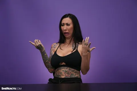 Lily Lane: Brunette with Enhanced Tits and Tattoo Reacts While Clothed – photo 13 of 21