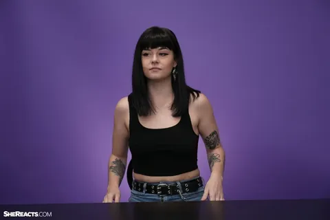 Lily Lane: Brunette with Enhanced Tits and Tattoo Reacts While Clothed – photo 14 of 21