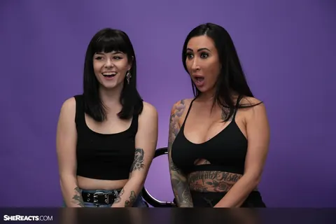 Lily Lane: Brunette with Enhanced Tits and Tattoo Reacts While Clothed – photo 1 of 21