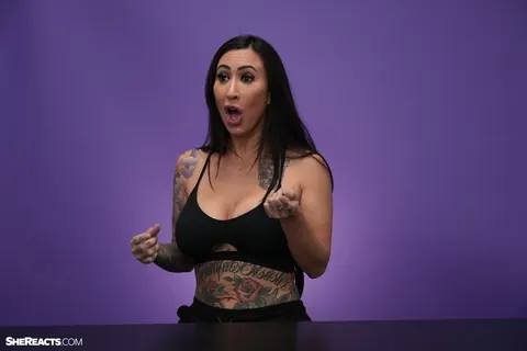 Lily Lane: Brunette with Enhanced Tits and Tattoo Reacts While Clothed – photo 8 of 21