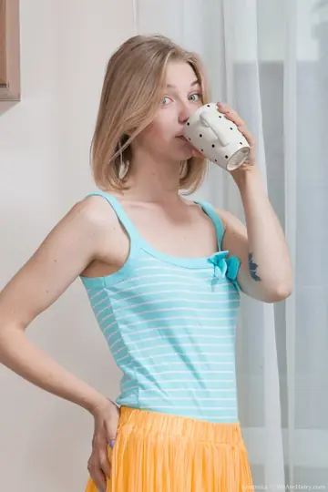Kristinka – Ukrainian Blonde Undresses and Fingers Her Hairy Pussy
