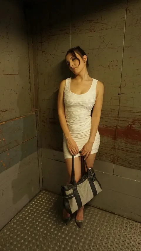 Ria River: German Brunette Undresses and Gets Fucked by Two Men in an Elevator – photo 4 of 21