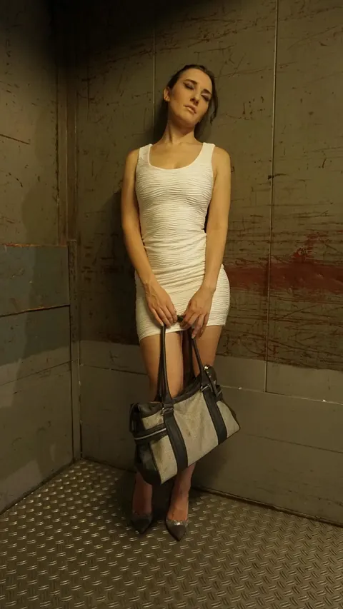 Ria River: German Brunette Undresses and Gets Fucked by Two Men in an Elevator – photo 6 of 21
