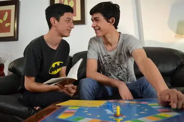 Two Men Kiss, Strip and Fuck Anal on the Sofa