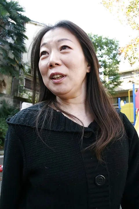 Mature Asian MILF Poses Outdoors in a Skirt – photo 4 of 16