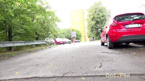 Lara Fox: Thick European Brunette Squats Behind a Car and Spreads Her Legs – photo 1 of 15