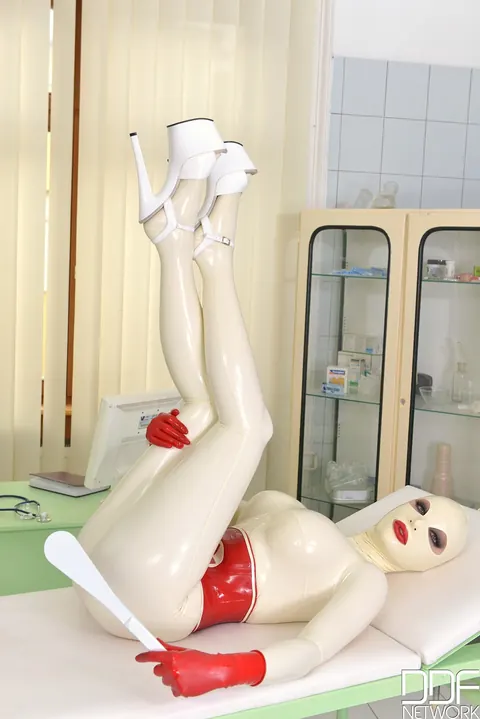 Latex Lucy: Busty British MILF Strips Out of Her Nurse Uniform and Uses a Toy While Bound – photo 10 of 21