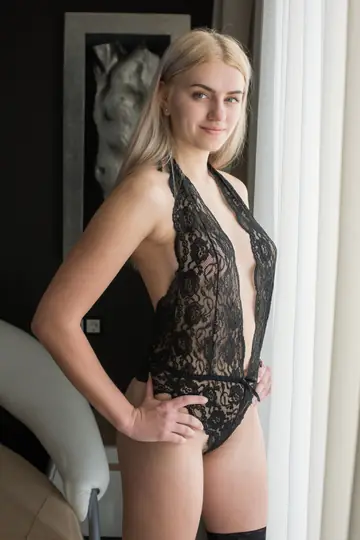 Busty Blonde Strips Out of Her Bodysuit and Spreads Her Hairy Pussy