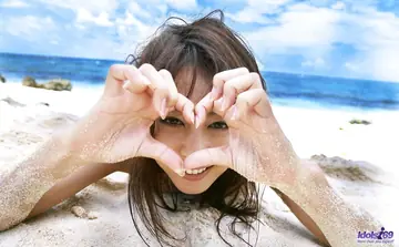 Japanese Brunette Shows Her Hairy Bush on the Beach