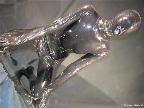 Woman in Latex Takes a Dildo in Her Mouth – photo 3 of 16