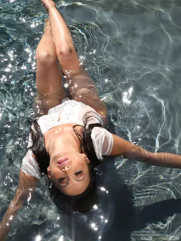 Mature Asian MILF Strips Out of Her Panties by the Pool