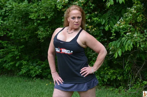 Stunning Summer: Mature Blonde with Big Tits Poses in a Skirt Over Shorts Outdoors – photo 8 of 15