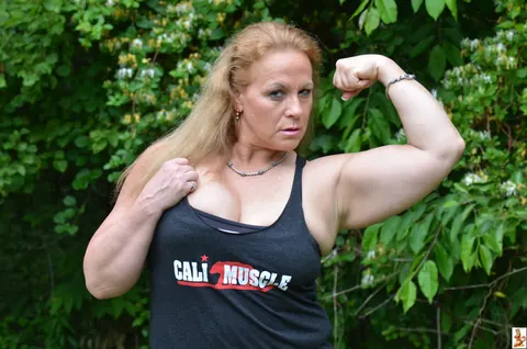Stunning Summer: Mature Blonde with Big Tits Poses in a Skirt Over Shorts Outdoors – photo 2 of 15