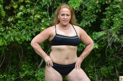 Stunning Summer: Mature Blonde with Big Tits Poses in a Skirt Over Shorts Outdoors – photo 3 of 15