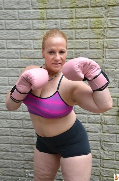 Stunning Summer: Mature Blonde with Big Tits Poses in a Skirt Over Shorts Outdoors – photo 4 of 15