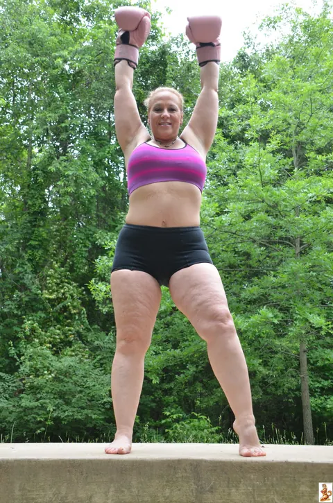 Stunning Summer: Mature Blonde with Big Tits Poses in a Skirt Over Shorts Outdoors – photo 5 of 15