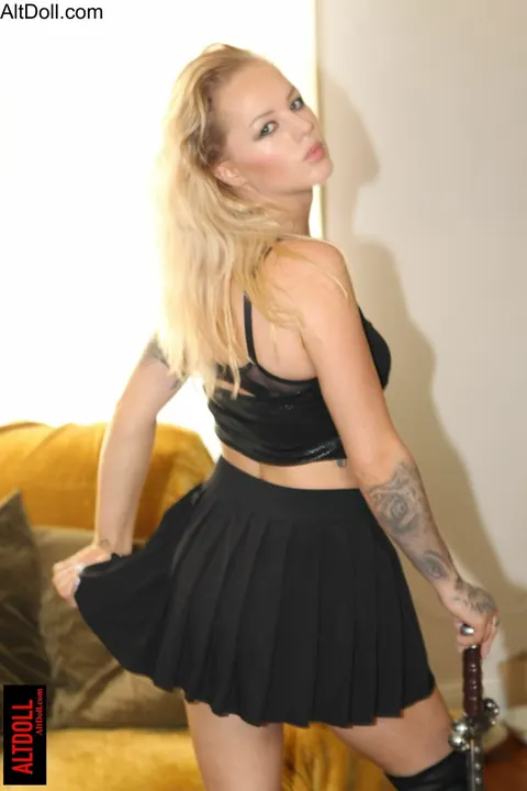 Blonde in Cosplay Costume Poses for Camera – photo 1 of 15