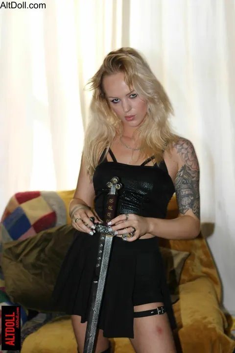 Blonde in Cosplay Costume Poses for Camera – photo 7 of 15