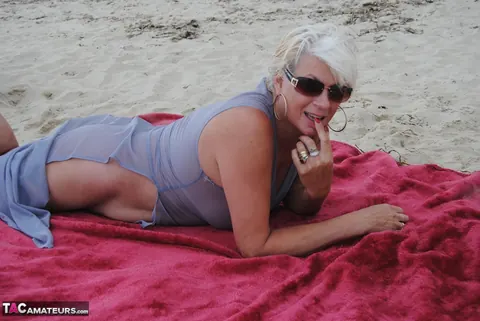 Blonde MILF Models a Sheer Dress on the Beach – photo 16 of 19