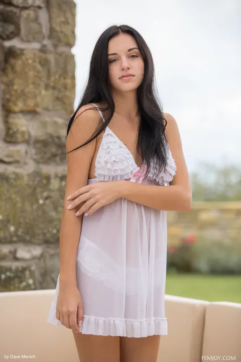 Woman Undresses and Spreads Her Legs on a Sofa Outdoors – photo 1 of 20