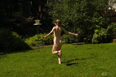 Michelle Anthony: Blonde in a Bikini Fingers Her Shaved Pussy on a Backyard Towel – photo 16 of 16