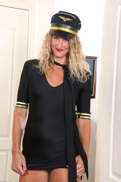Slim Blonde MILF Strips Off Her Uniform and Fingers Her Trimmed Pussy – photo 9 of 21