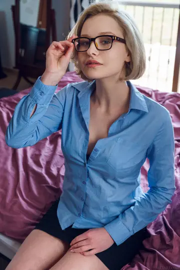 Short-Haired Blonde in Glasses Strips Naked