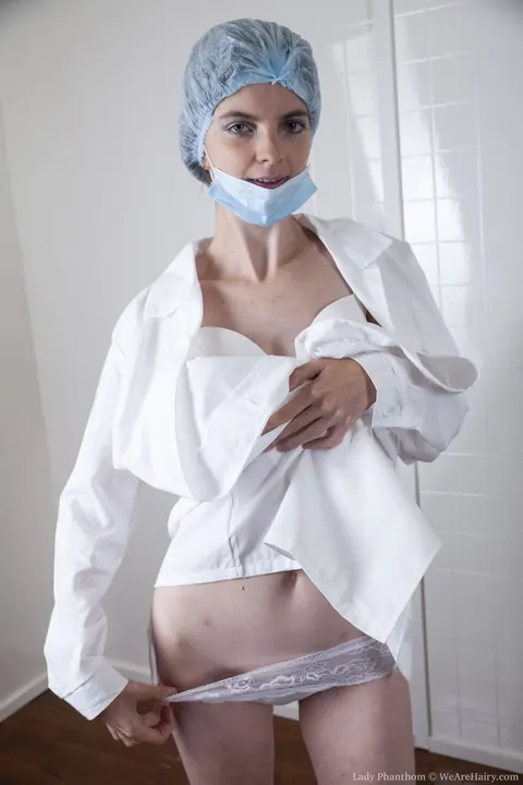 Lady Phanthom: Slim Brunette Nurse Pulls Aside Her Panties to Show Her Hairy Bush – photo 3 of 20