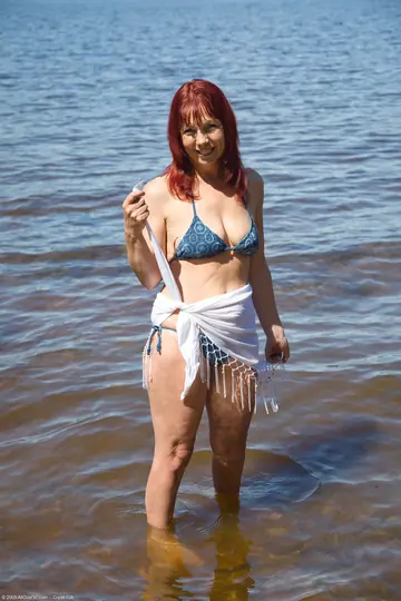 Tall Redhead MILF Strips Out of Her Bikini on the Beach