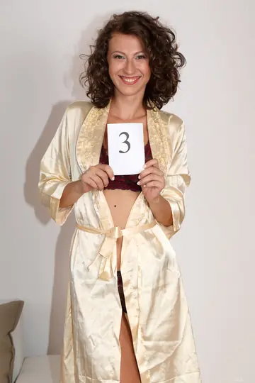 Brunette Amateur with Short Curly Hair Spreads Her Legs