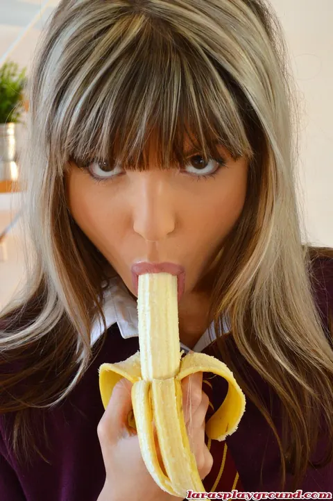 Gina Gerson: Petite Brunette in Stockings and Uniform Sucks a Banana Outdoors – photo 4 of 8