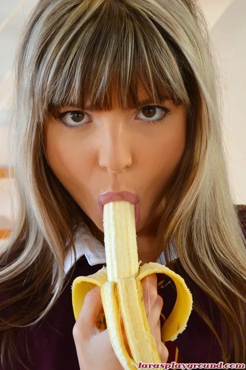 Gina Gerson: Petite Brunette in Stockings and Uniform Sucks a Banana Outdoors – photo 3 of 8