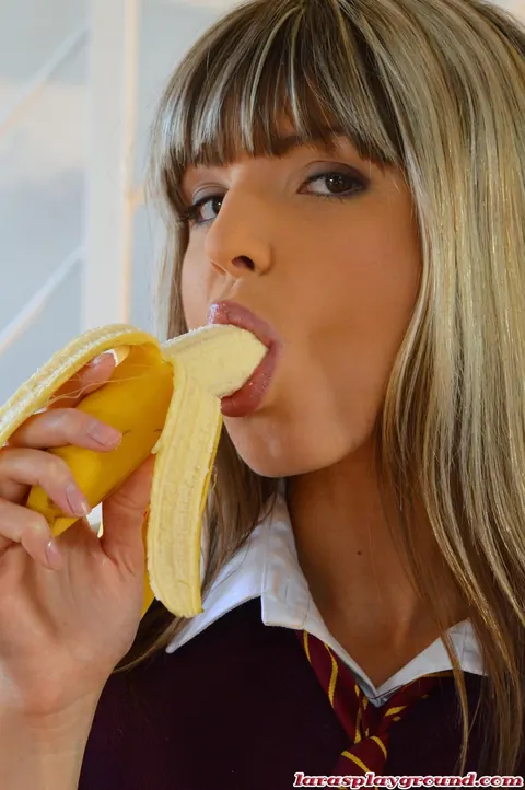 Gina Gerson: Petite Brunette in Stockings and Uniform Sucks a Banana Outdoors – photo 7 of 8