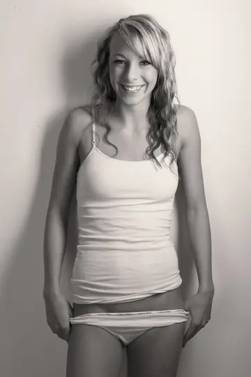 Short Curly Blonde Drops Her Shirt and Panties to Show Off Her Nude Body