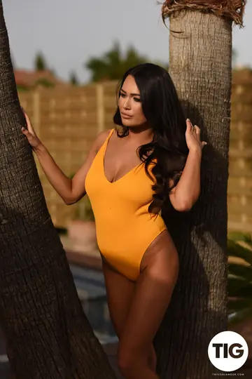 Jodie James – British Brunette Strips Out of Her Bikini Bodysuit Outdoors