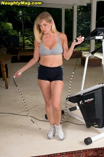 Blonde MILF Fingers and Fucks a Dildo in the Gym