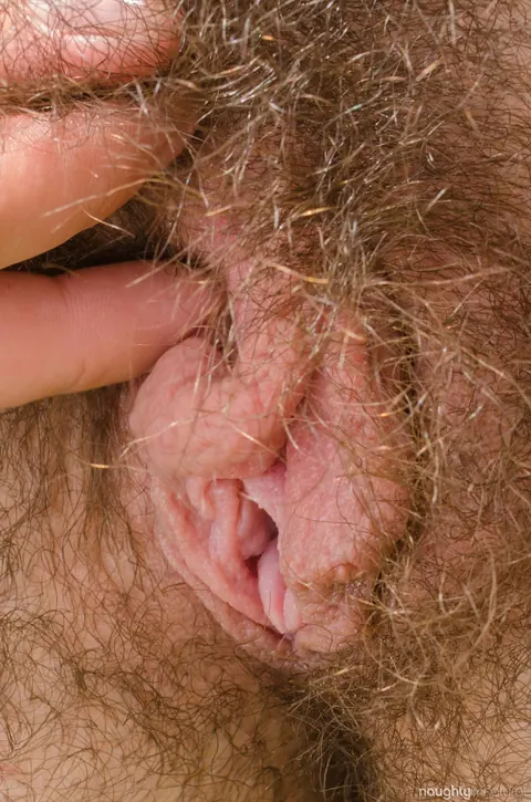 Kisa Fae: Brunette in a Bodysuit Shows Her Hairy Pussy and Tattoo – photo 18 of 20